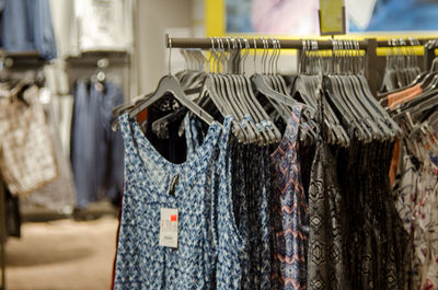 Close-up of clothes hanging on display at store