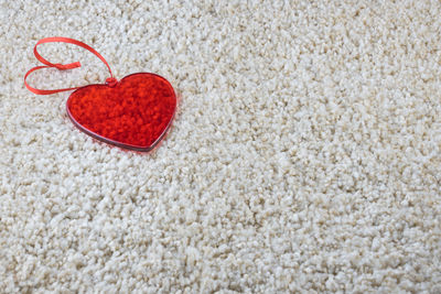 Close-up of heart shape on white surface