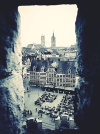 Buildings in city against clear sky