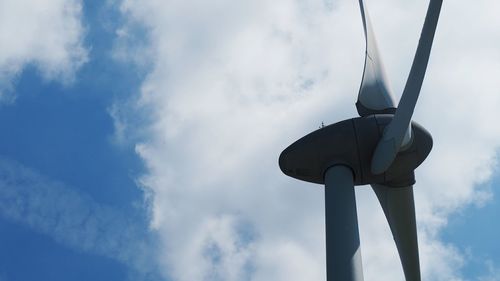 Low angle view of wind turbine against sky