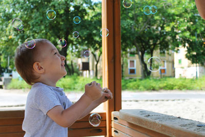 Boy looking at bubbles