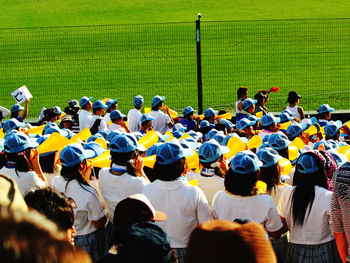 Rear view of people sitting in park