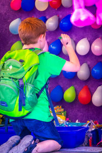 Boy playing with toy toys