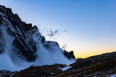 Scenic view of snowcapped mountains against sky during winter