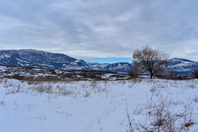 Scenic view of snowcapped mountains against sky