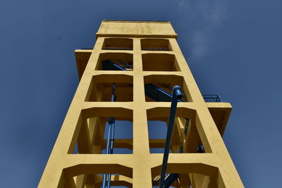 Low angle view of built structure against blue sky