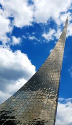 Low angle view of building against cloudy sky