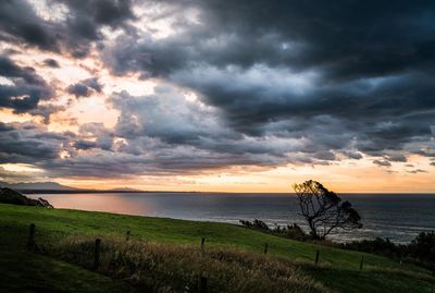 Scenic view of sea against dramatic sky