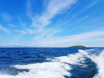 Scenic view of sea against blue sky