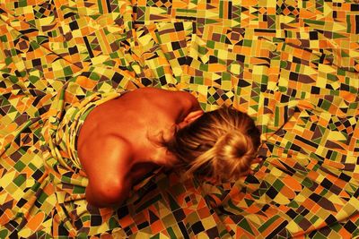 High angle view of friends relaxing on floor