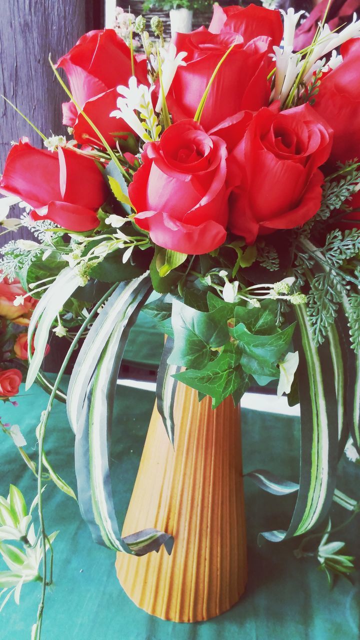 flower, red, potted plant, freshness, plant, petal, vase, indoors, fragility, growth, table, flower head, beauty in nature, nature, bouquet, close-up, leaf, flower pot, no people, flower arrangement