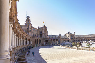 Buildings in town against sky