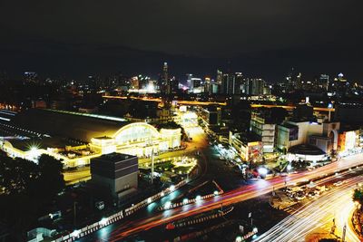 High angle view of light trails on road at night