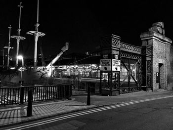 Illuminated street light against clear sky at night
