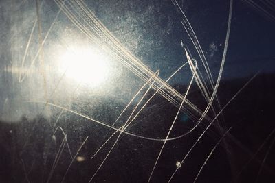 Low angle view of spider web against sky