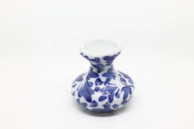 Close-up of blue over white background
