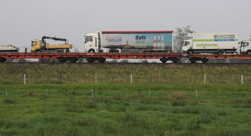 Train on field against sky