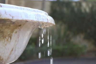 Close-up of water falling from faucet