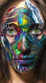 Close-up portrait of woman with face paint