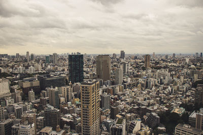 High angle view of modern buildings in city against sky