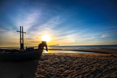 Scenic view of beach against sky during sunset