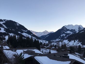 Scenic view of snowcapped mountains against clear sky