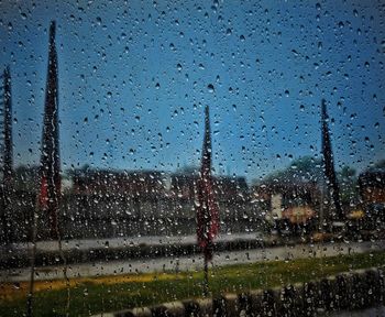 Raindrops on glass window in rainy season