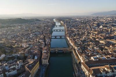 Aerial view of florence along the arno river and the old town from above, tuscany, italy,