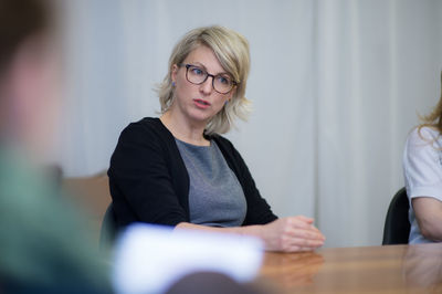 Beautiful businesswoman talking during meeting at conference room