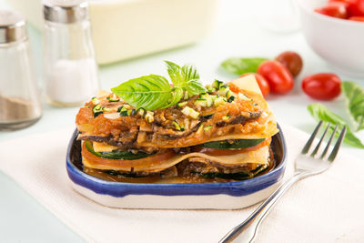 Close-up of lasagna in bowl on table