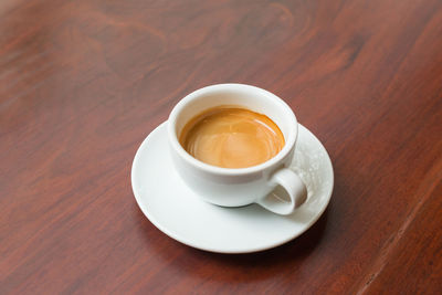 High angle view of coffee cup on table