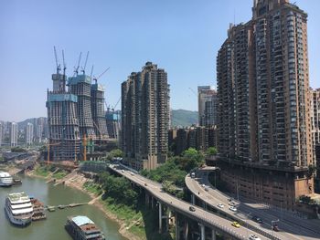 Modern buildings in city against sky