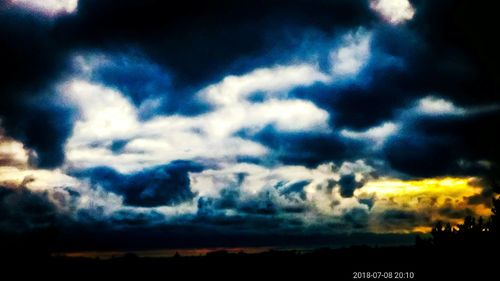 Low angle view of dramatic sky during sunset