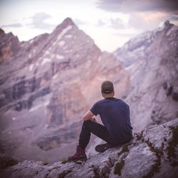 Rear view of man standing on mountain