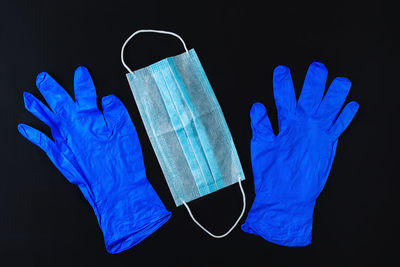 Close-up of human hand over black background