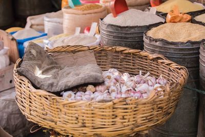 Close-up of garlic in whicker basket