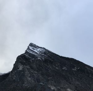 Low angle view of mountain range against sky