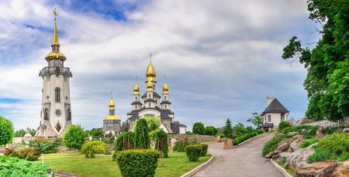 Temple complex with landscape park in buki, ukraine, on a cloudy summer day