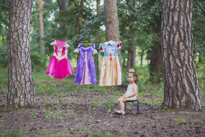 Charming baby hung out princess costumes to dry