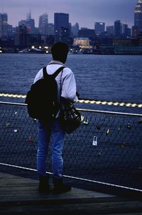 Rear view of woman standing in river