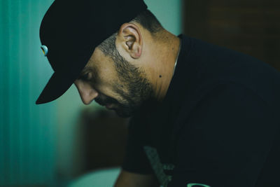 Side view of young man looking away