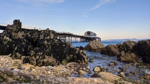 Bridge over sea against sky