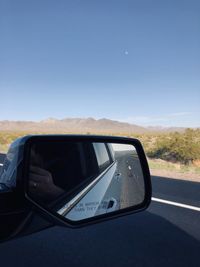 Car on road against clear sky