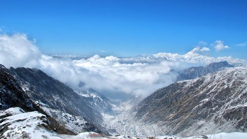 Scenic view of snowcapped mountains against sky