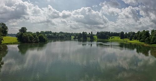 Scenic view of lake against cloudy sky