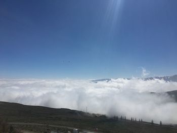 Scenic view of clouds over mountain range