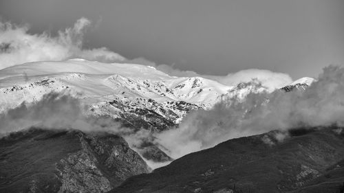 Scenic view of snowcapped mountains against sky