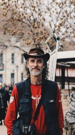 Portrait of man wearing hat standing outdoors