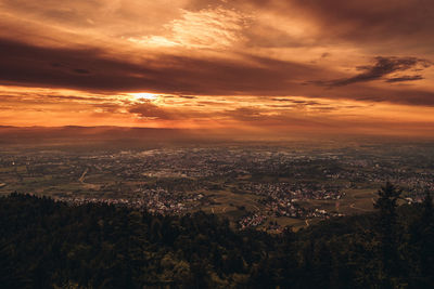 Scenic view of sunset over city