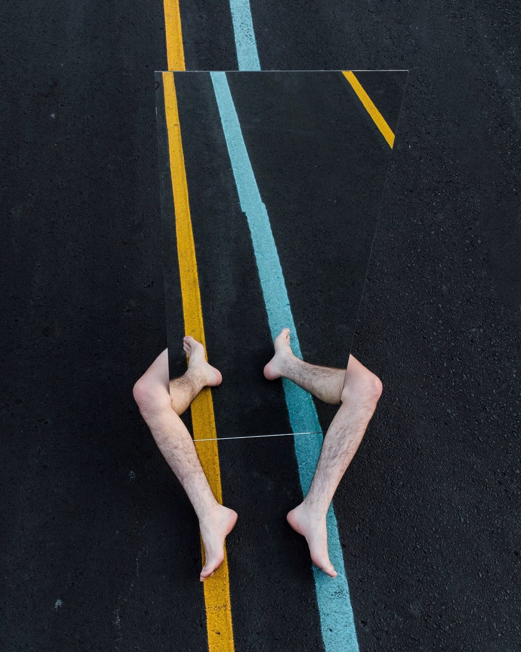 road marking, high angle view, two people, yellow, real people, road, day, men, low section, outdoors, human body part, human hand, people